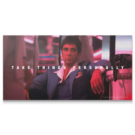 Close-up of Tony Montana's intense facial expression on the 'Scarface - Take Things Personally' poster.