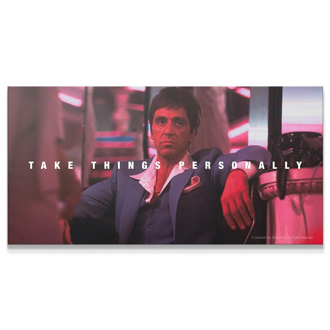 Close-up of Tony Montana's intense facial expression on the 'Scarface - Take Things Personally' poster.