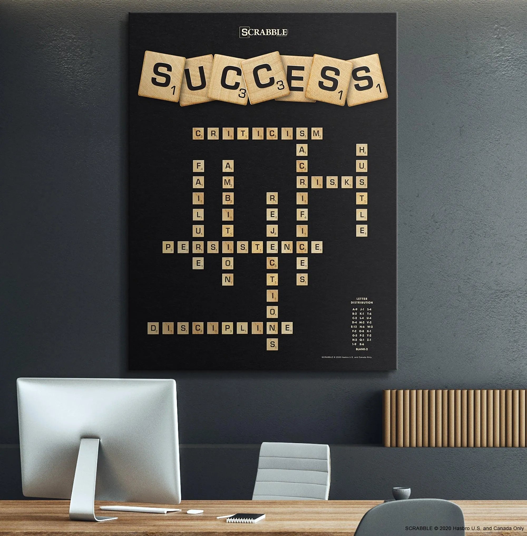 Lifestyle image of the 'Scrabble - Success' artwork hanging above a modern office desk, providing daily motivation.