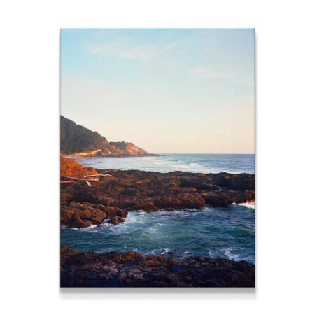 Full view of 'Seaside' coastal canvas print featuring rugged basalt rocks and ocean.