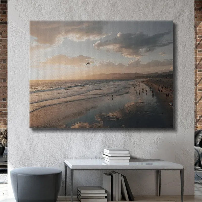 Lifestyle shot featuring a solitary seagull soaring against the dramatic cloudy sky, symbolic of Seaside Moments.