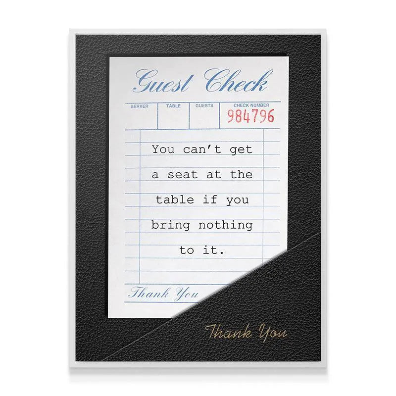 Macro view showing the quote typeface and red check number 984796 details on the 'Seat At The Table' artwork.