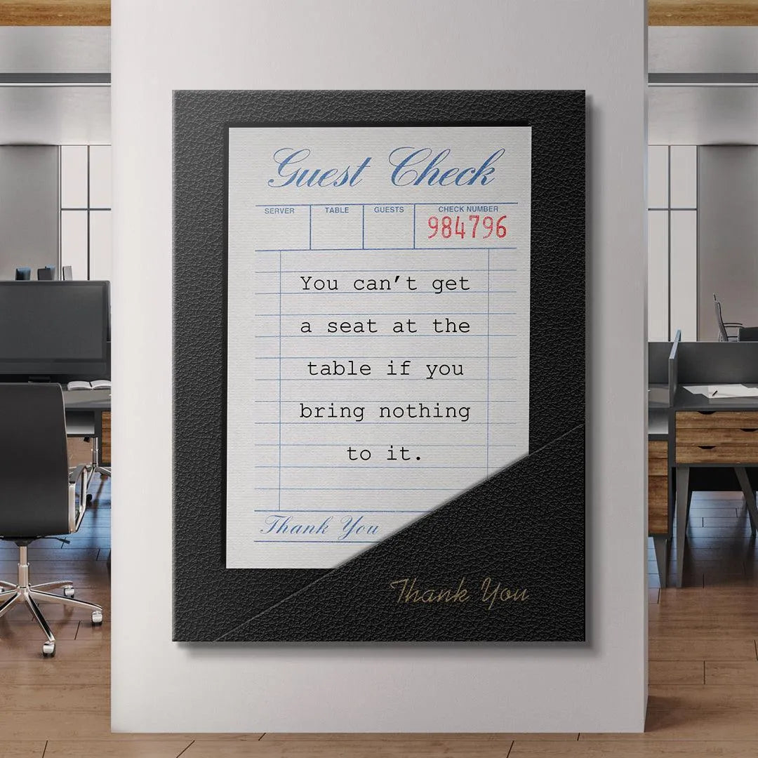 Conceptual lifestyle image showing the 'Seat At The Table' print displayed prominently on an entrepreneur's desk.