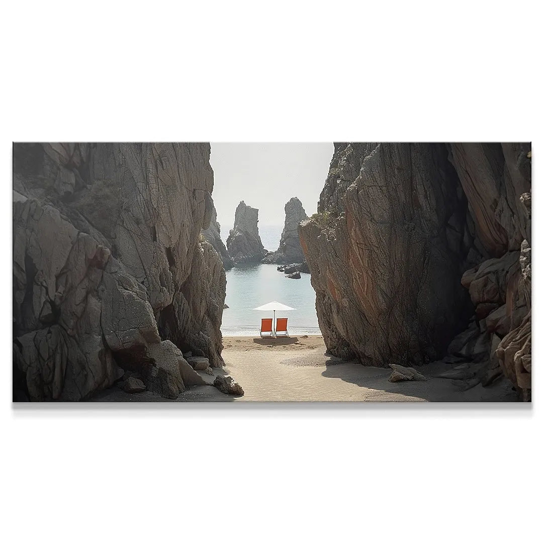 Panoramic view of a hidden Secluded Beach cove framed by massive gray cliffs.