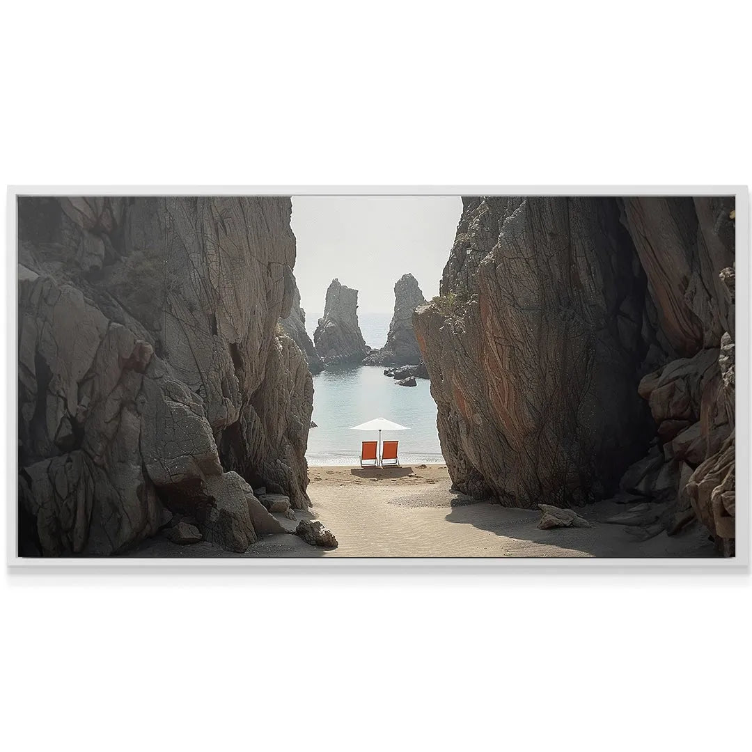 Wide shot of the two orange chairs and white umbrella situated on the Secluded Beach sand.