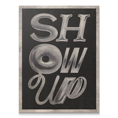 Close-up texture of the metallic silver 3D letters on the 'Show Up' canvas art.
