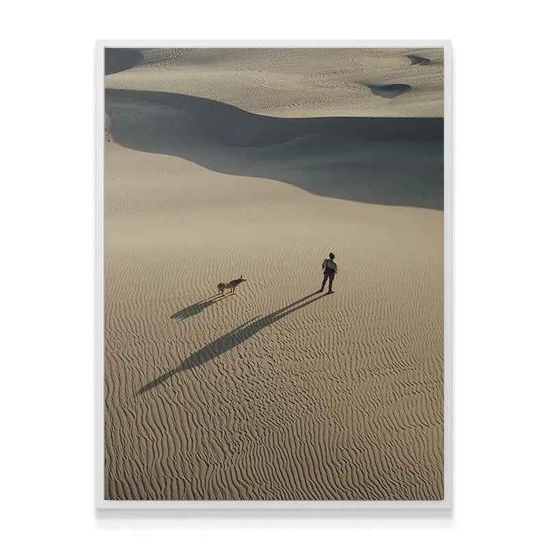 Close-up on the textural pattern of the sand dunes with two travelers Side by Side.
