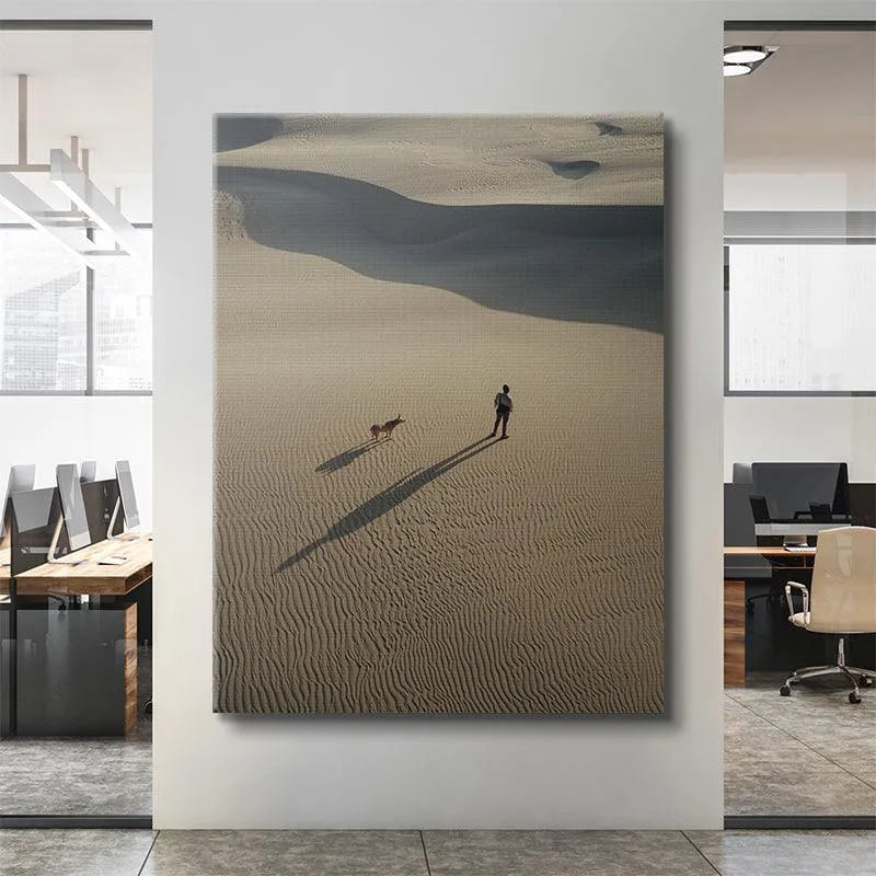 Aerial perspective showing the stark contrast of light and shadow on the dunes, figures remaining Side by Side.