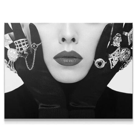 High-contrast close-up of model with black gloves and dazzling Silver stones rings