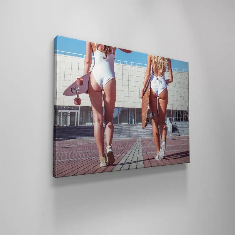 Low angle shot emphasizing the long legs and sneakers of the 'Skate Bums' duo as they walk.