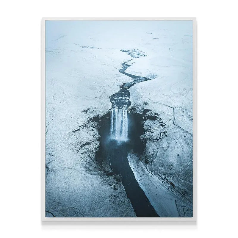 Winter landscape canvas featuring the winding river path leading directly to Skogafoss.