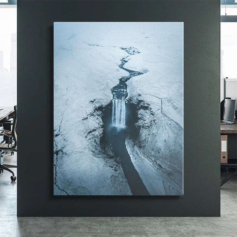 Vertical wall art print depicting the monochromatic blue tones of Skogafoss in deep winter.