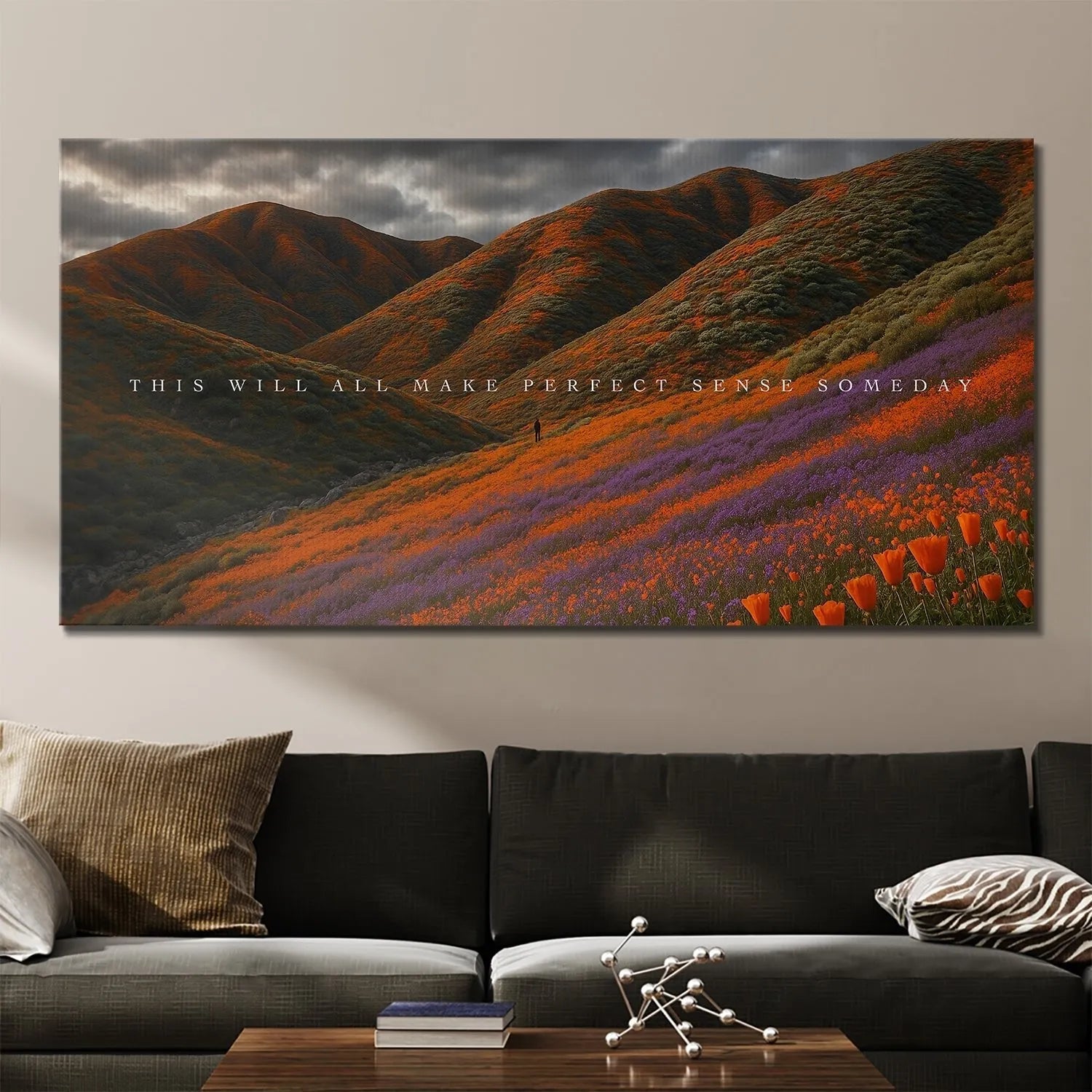 Silhouette of a lone figure walking across the purple and orange flower slopes in the Someday artwork.