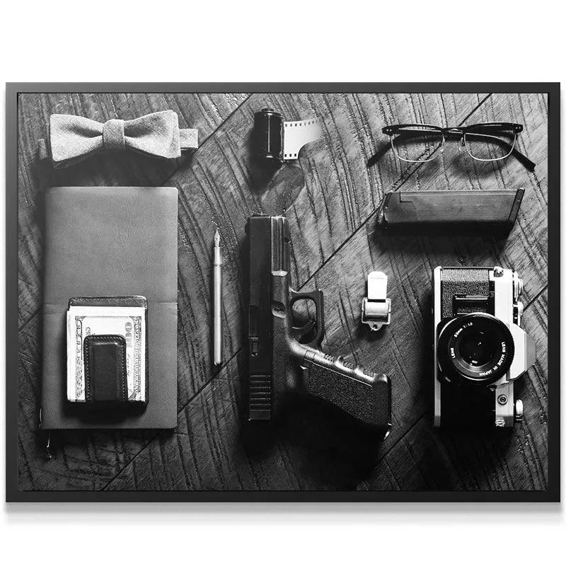 Top-down view of the entire collection of black and white Spy Essentials laid on wooden surface.
