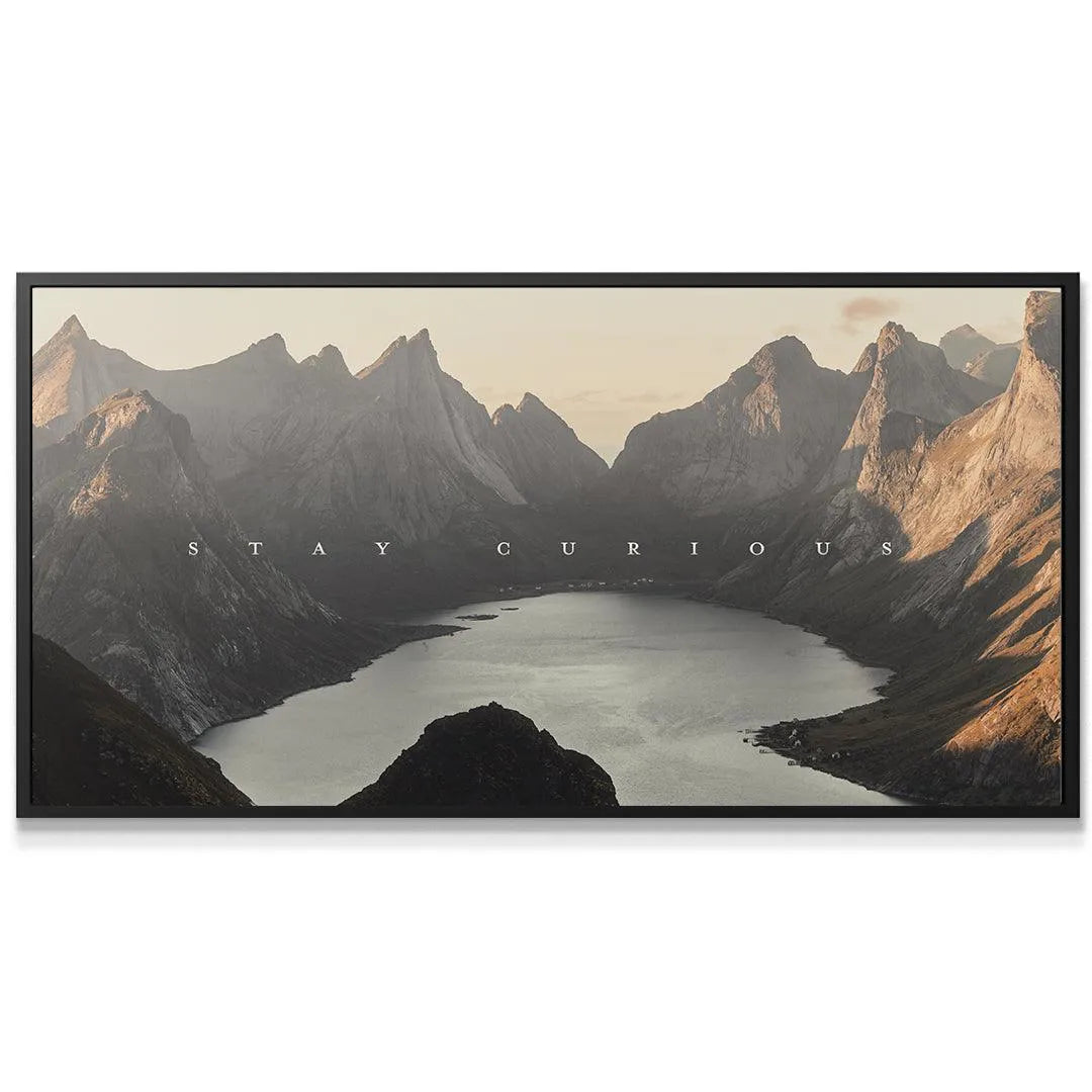 Close-up detail of the rugged mountain peaks catching the soft, early morning light: Stay Curious (shortstache™︎).