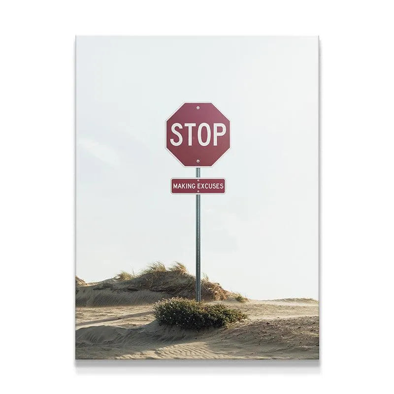 Motivational desert photo print featuring the instruction 'Stop Making Excuses' prominently displayed on a custom road sign.