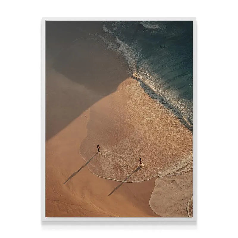 Full vertical composition of Strangers or Friends featuring dramatic long shadows on golden beach.