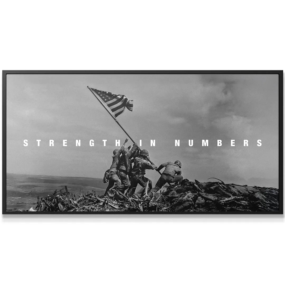 Close-up of the soldiers hoisting the flag, highlighting the text placement of 'Strength In Numbers' below the horizon.