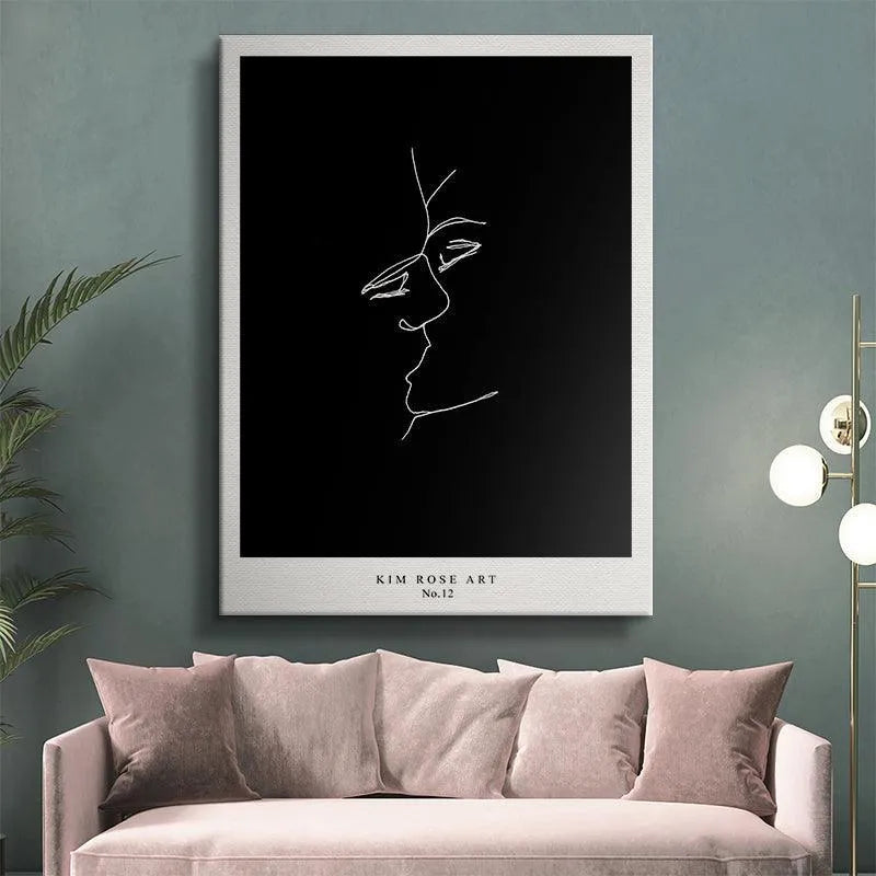 Lifestyle shot of the Sun and Moon - Black poster hanging above a contemporary grey sofa.