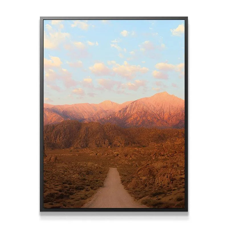 Close-up view of the sun-drenched, rocky texture in the foreground of 'Sunrise In the Sierras'.