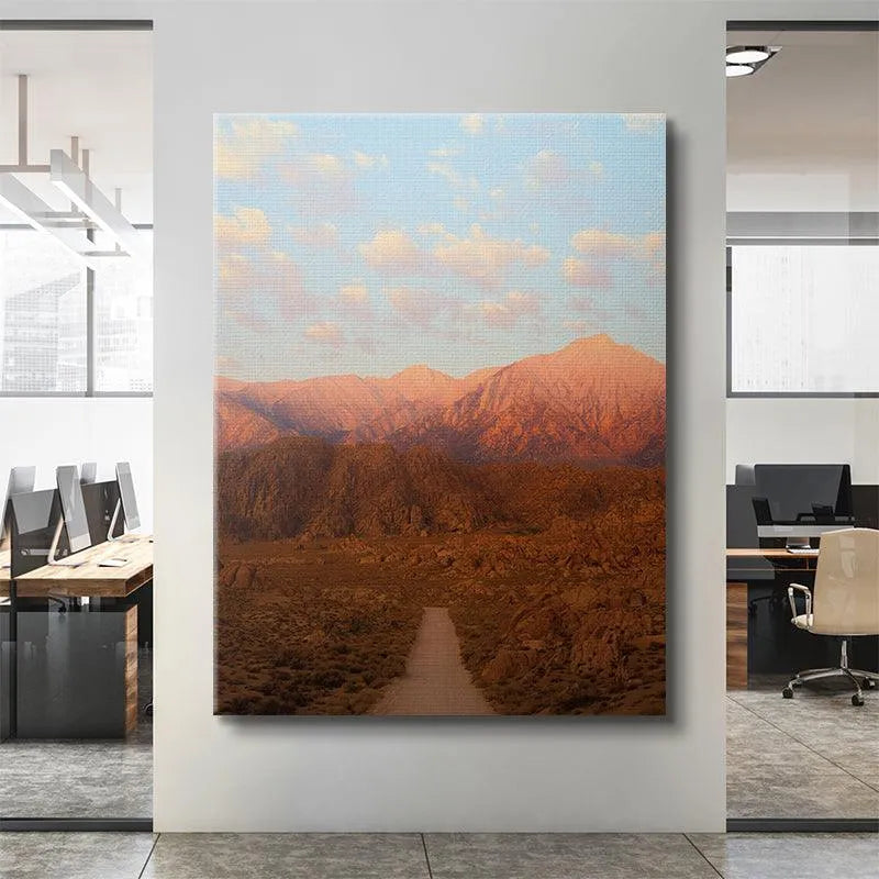 Detail of the pastel blue sky and soft white clouds above 'Sunrise In the Sierras' artwork.