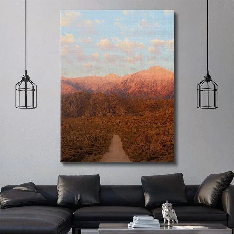 Lifestyle mockup showing the framed print of 'Sunrise In the Sierras' in a minimalist living room setting.