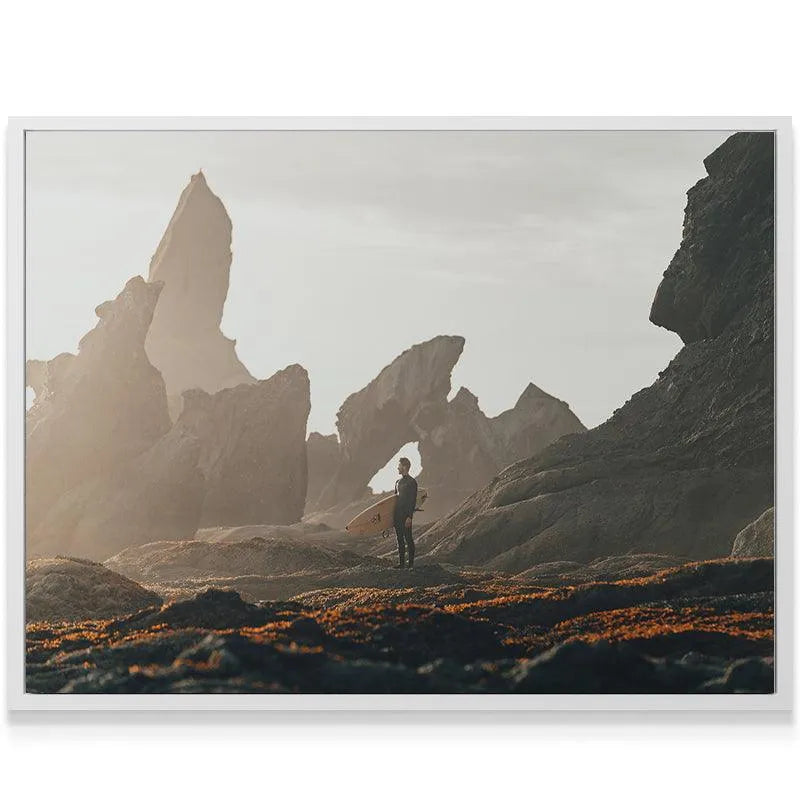 Golden hour photograph showing hazy, diffused light illuminating the beach where the Swell Watcher stands.