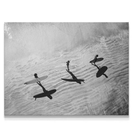 High-angle black and white photo showing surfers and dramatic shadow reflections, titled Textured Waves.