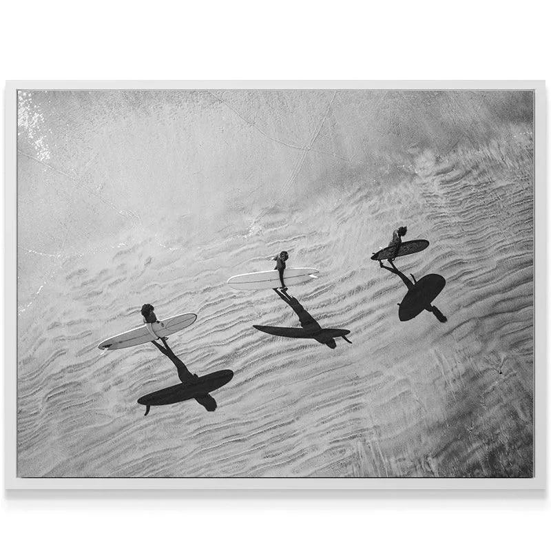Three surfers walking across the beach, seen from directly above in the stunning art piece Textured Waves.