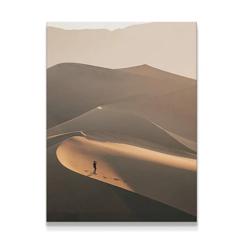 Full view of 'The Distant Viewer' showing the dramatic scale of desert dunes against a single person.