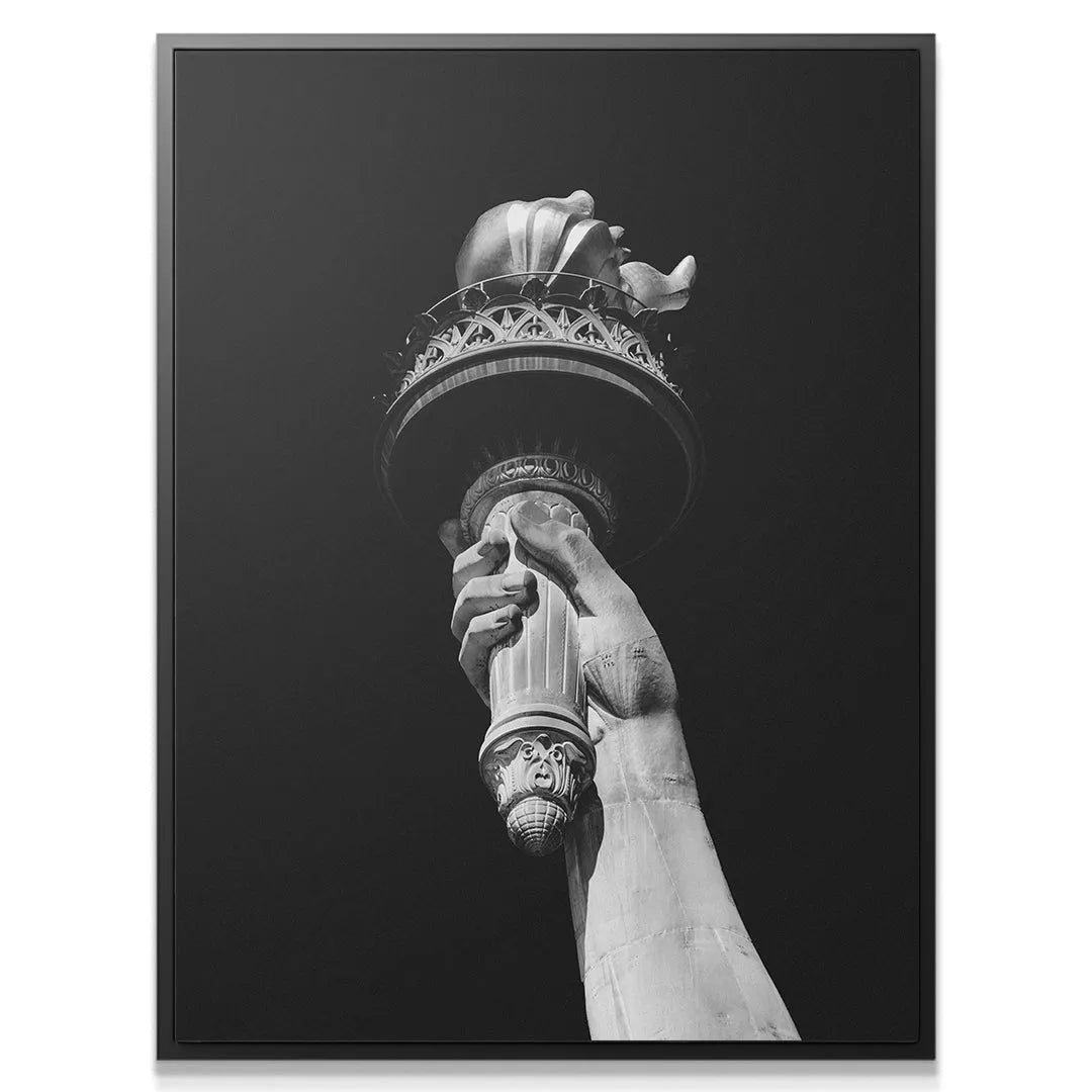 Dramatic monochrome shot emphasizing the upward reach of 'The Hand of Liberty - B&W' against a dark sky.