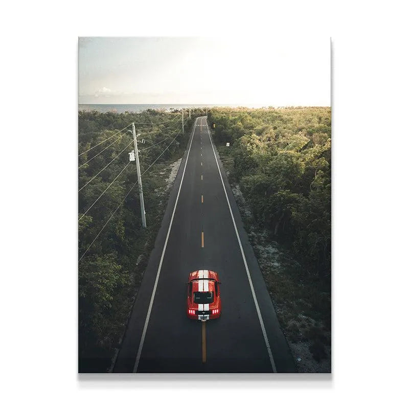 High-angle drone shot showing the dramatic scale of "The Journey" down the straight coastal highway.