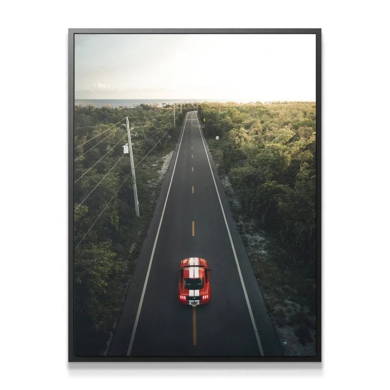 Close-up view of the vibrant red sports car with white stripes defining the momentum of "The Journey".