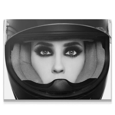 Extreme close-up of the subject's intense gaze peering through the visor opening, highlighting the drama of 'The Reveal'.