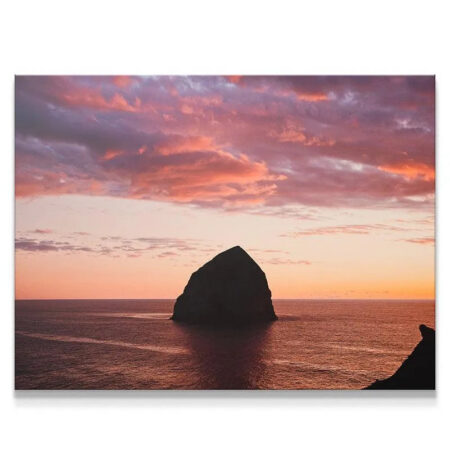 Close-up of the textured clouds above The Rock during the vibrant sunset.