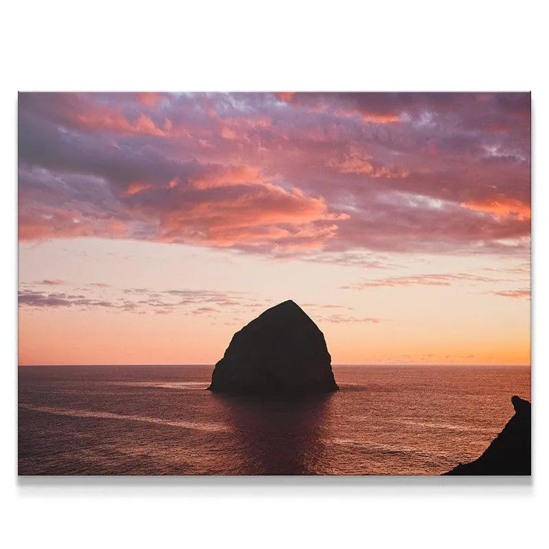 Close-up of the textured clouds above The Rock during the vibrant sunset.
