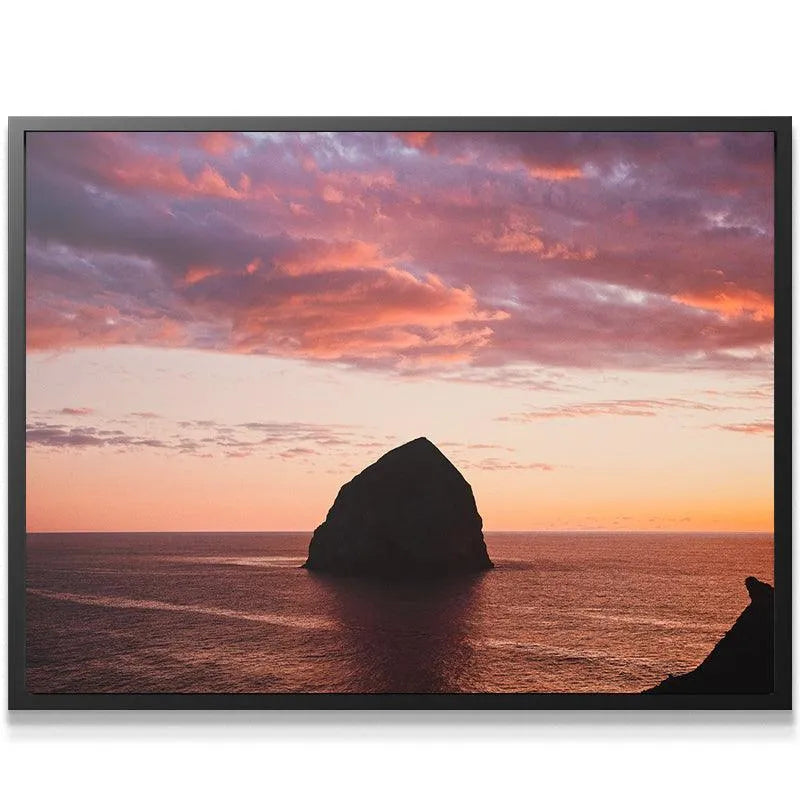 Wide shot showcasing the solitary profile of The Rock against the vast, open ocean backdrop.