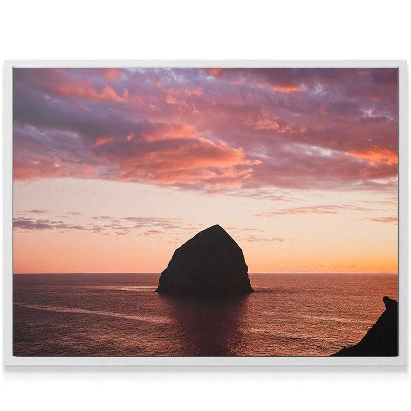 Lifestyle view: The Rock canvas print hanging above a modern minimalist sofa in a living room.