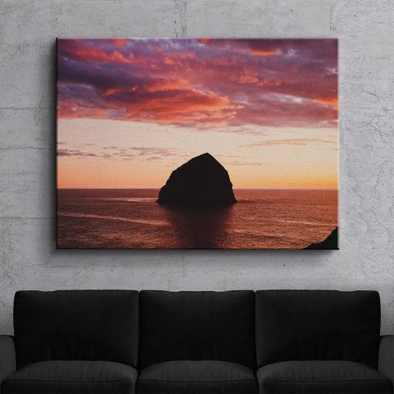 Low angle perspective emphasizing the immense scale and dark silhouette of The Rock at twilight.