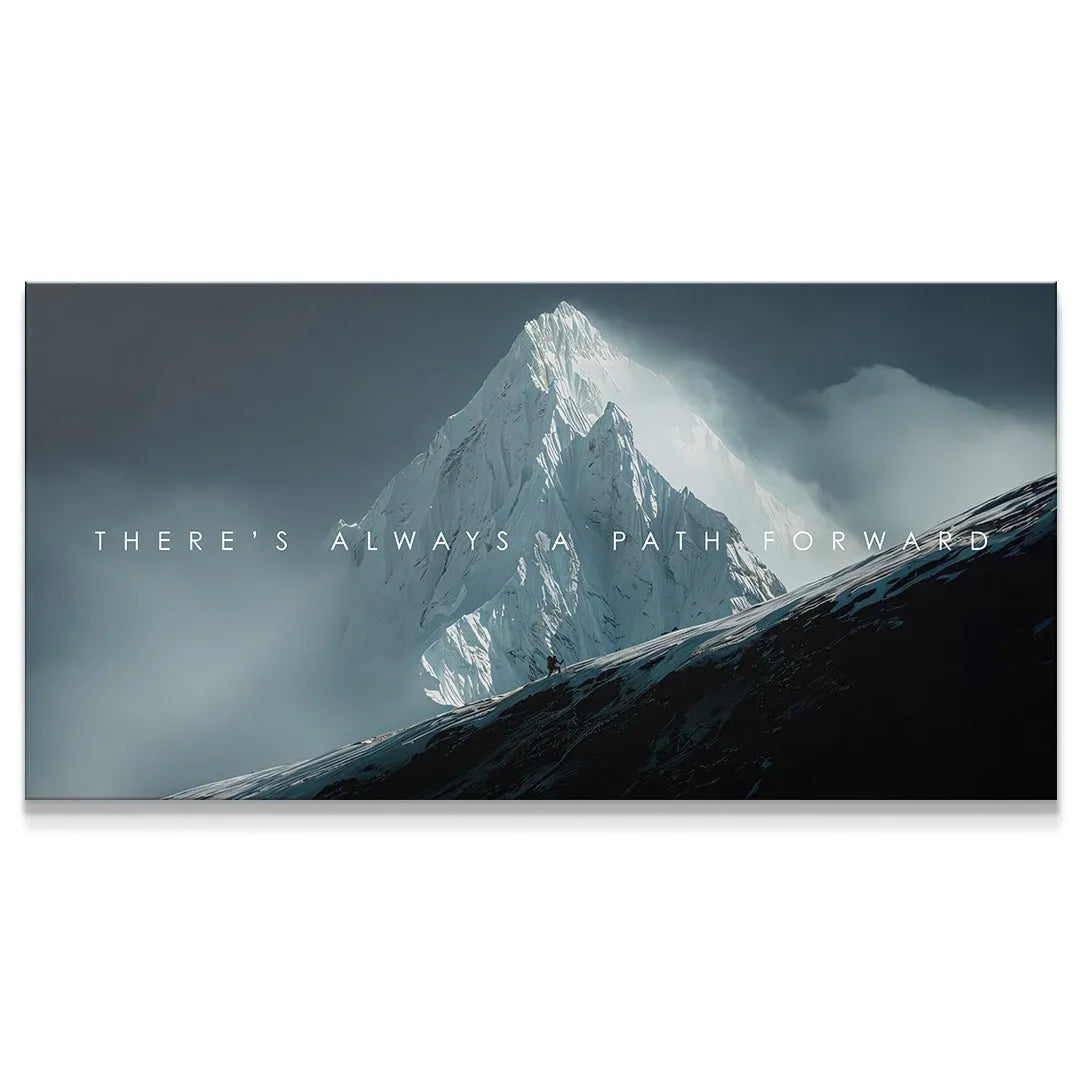 Wide landscape view of a snowy mountain peak with the motivational text: There's Always A Path Forward.