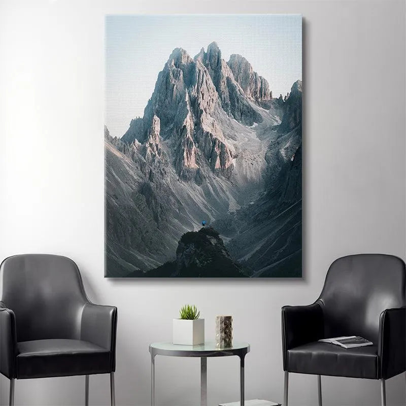 Detailed view of the sunlit ridge lines and shadows defining the Three Peaks artwork.