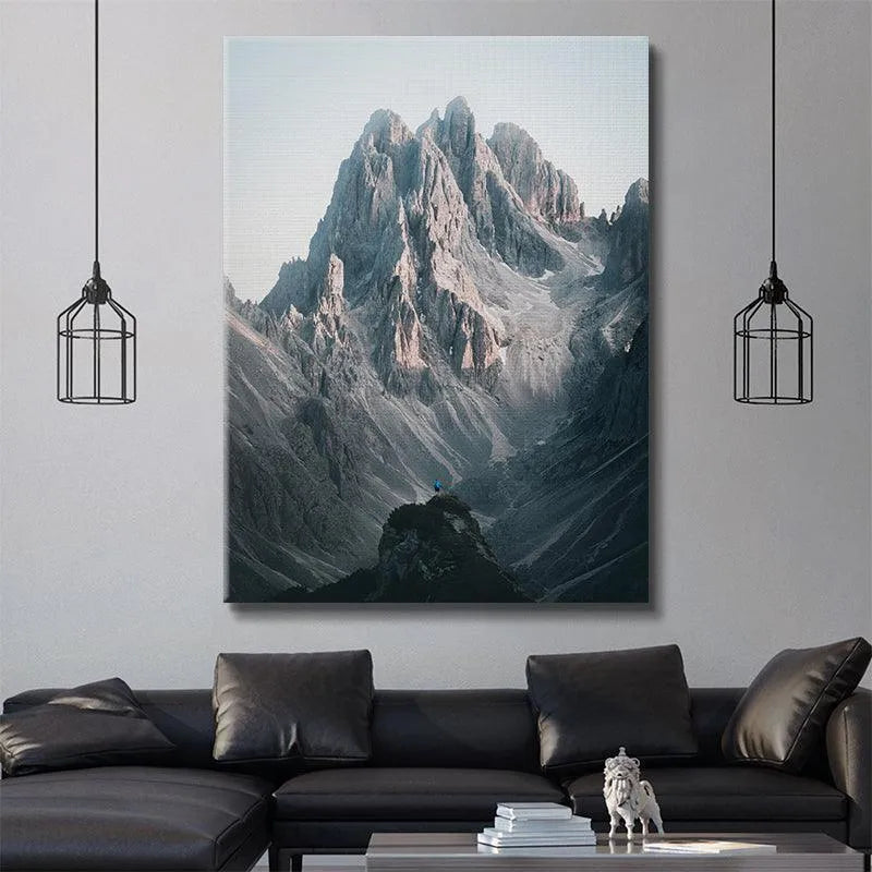 Wide landscape focusing on the dramatic scale contrast near the Three Peaks.
