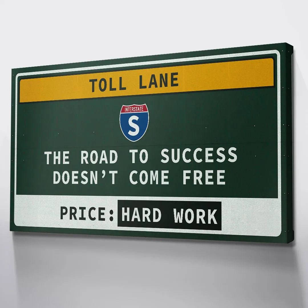 Macro detail focusing on the red and blue Interstate S symbol on the center of the Toll Lane graphic.