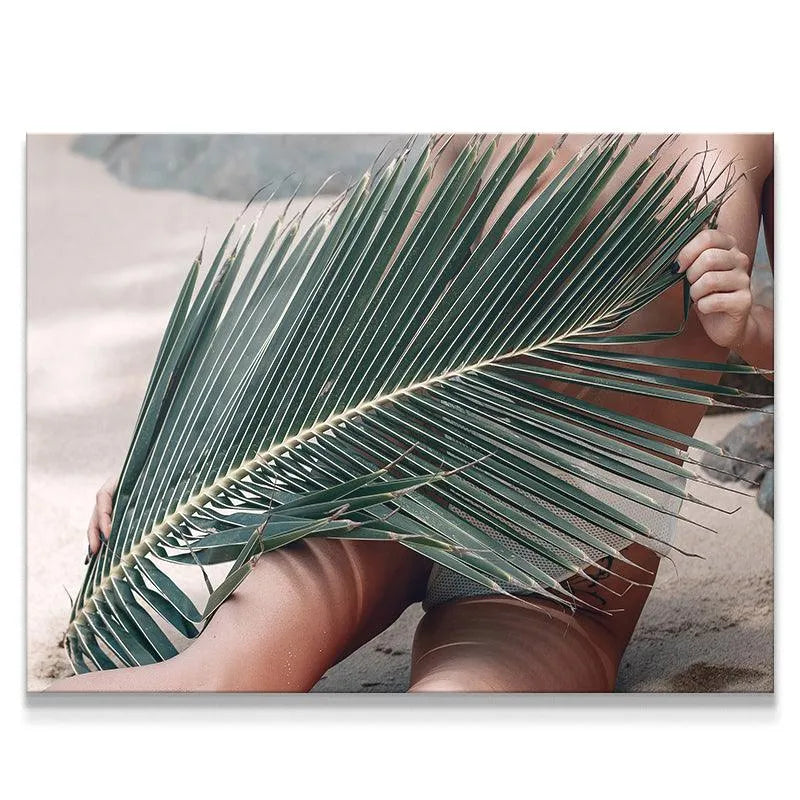 Close-up of the textured palm frond concealing the subject on the Topless Beach.