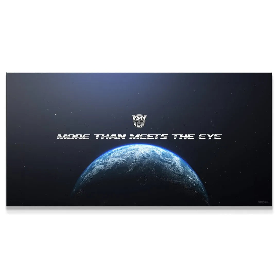 Wide shot of Earth from space emphasizing the slogan 'Transformers - More Than Meets The Eye' banner art.