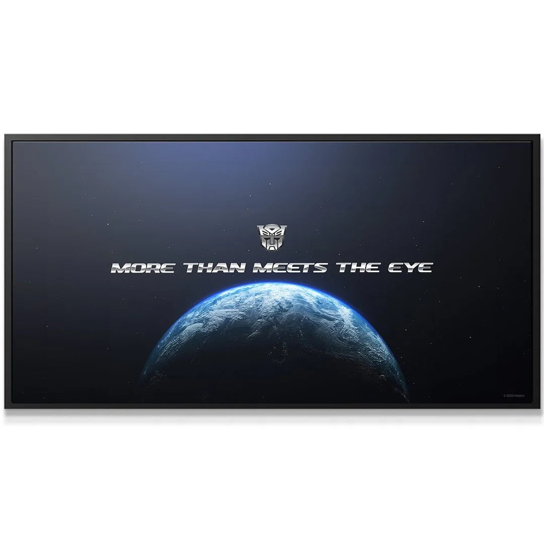 Detail close-up of the metallic Autobot insignia centered above the curved horizon in the 'Transformers - More Than Meets The Eye' print.