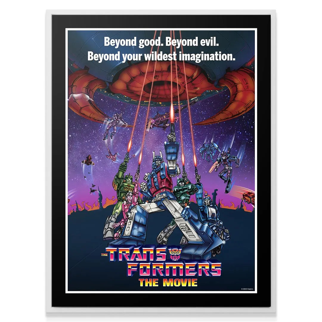 Medium shot of the central characters, including Ultra Magnus and Hot Rod, in the action scene of Transformers - The Movie.