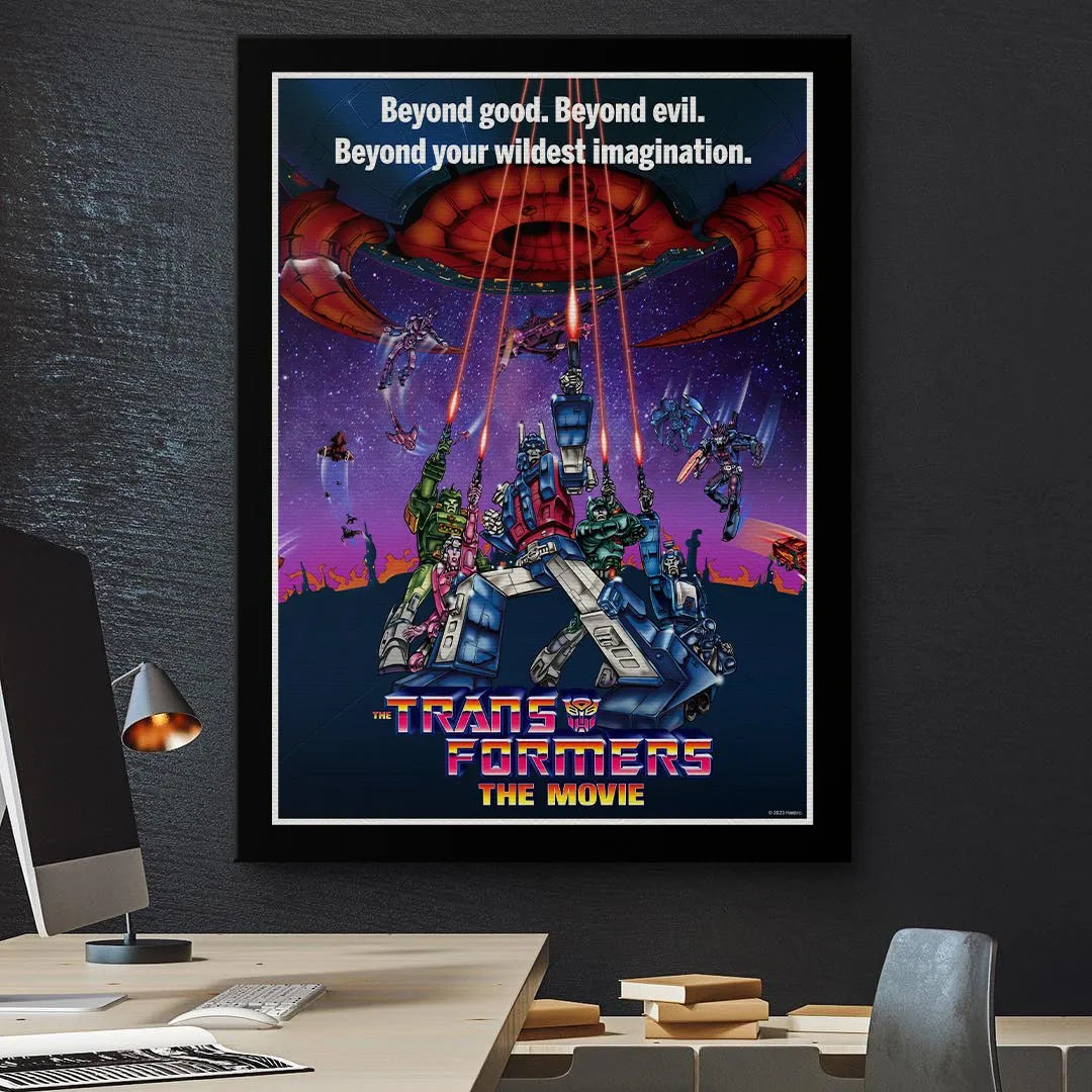 Framed lifestyle view of the official artwork for Transformers - The Movie hanging on a fan's wall.