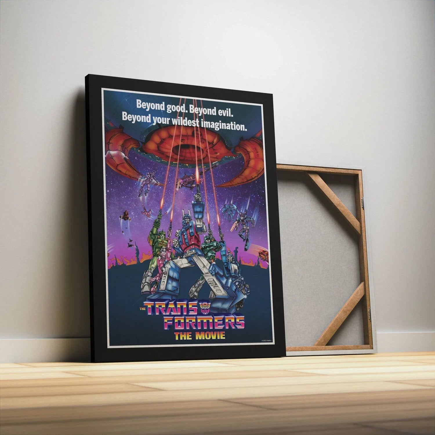 Low angle perspective of the Autobots firing their weapons in the climactic battle poster for Transformers - The Movie.