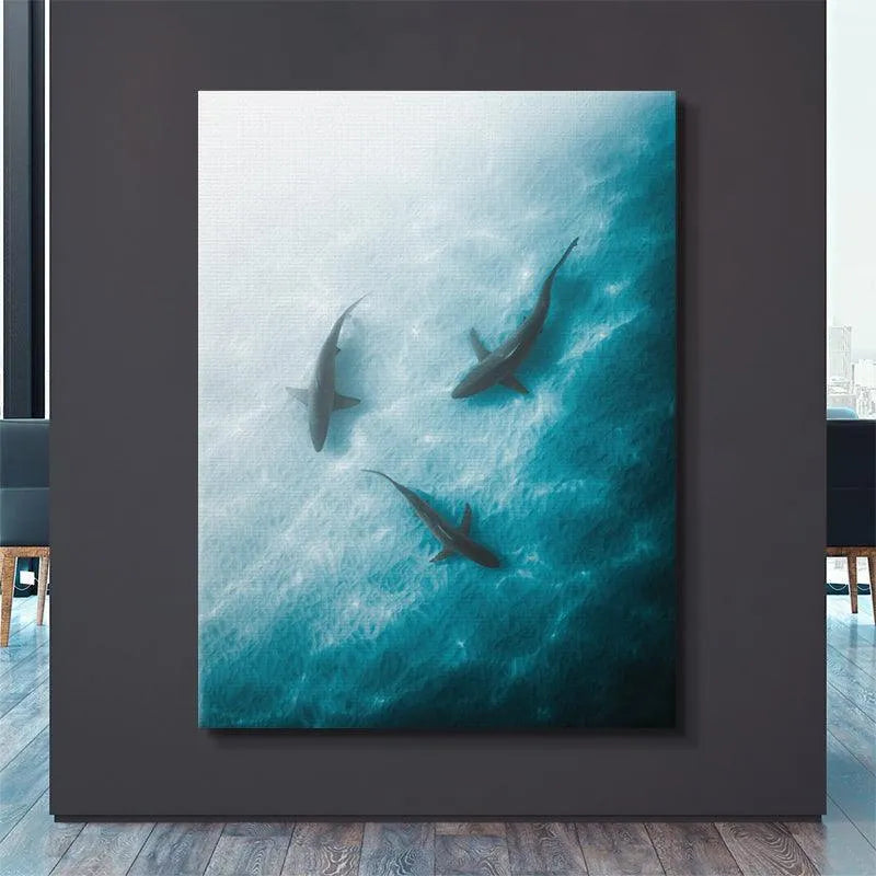 High-contrast photograph of the 'Triple Threat' marine predators swimming in formation.